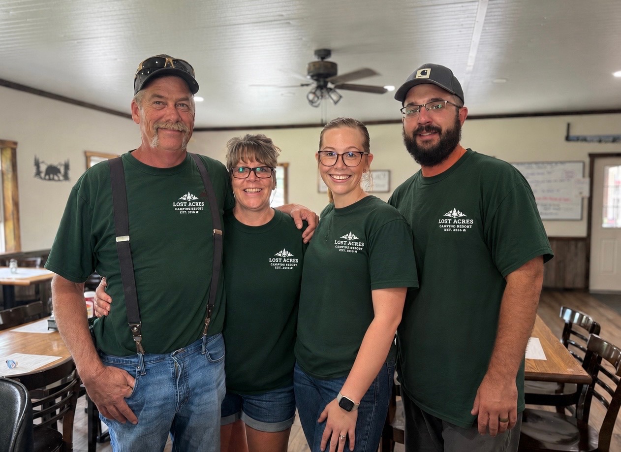 The Lost Acres family — John, Tracy, Carlee & Carter — in the dining room