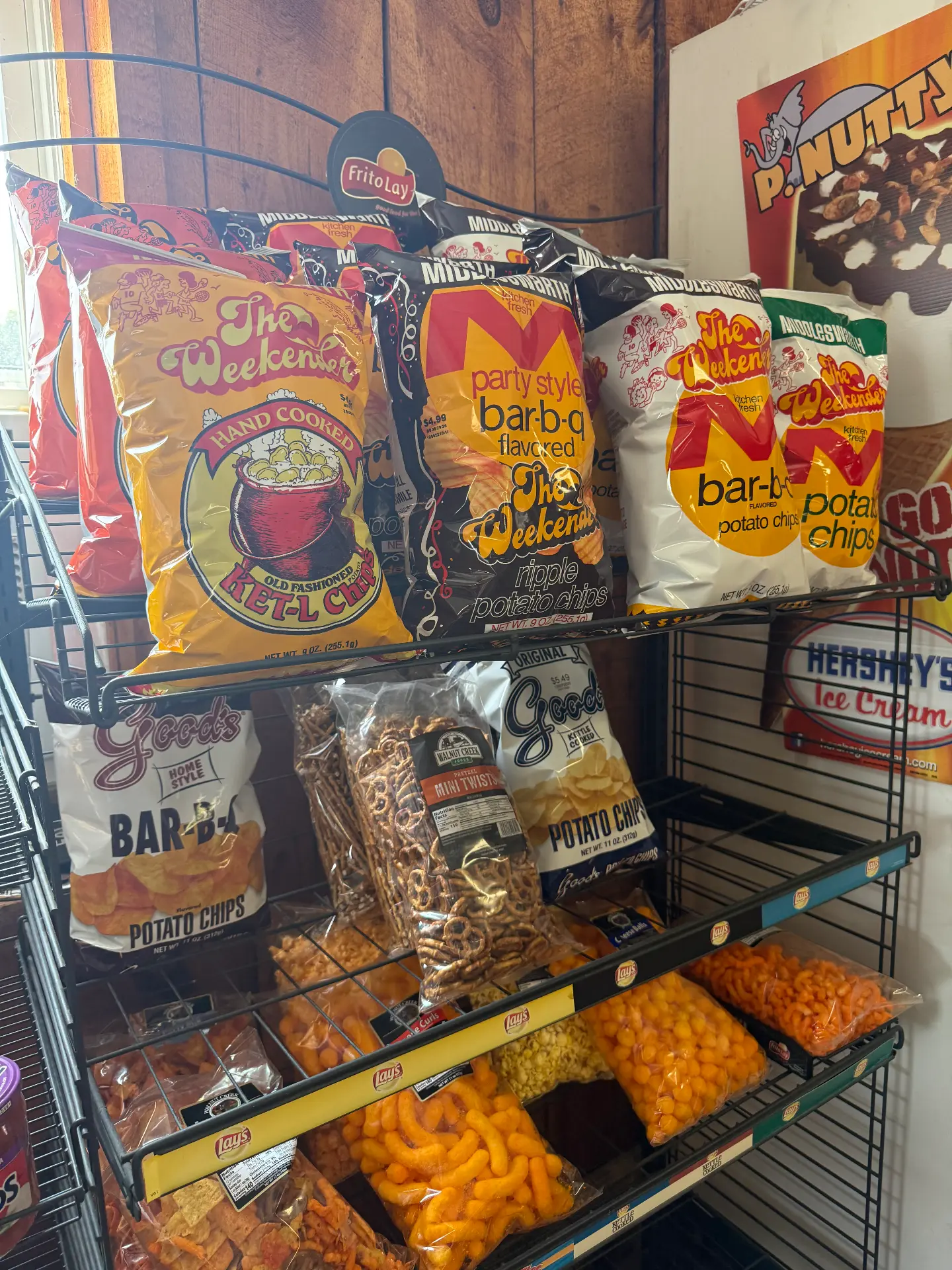 Rack of Middleswarth, Good's and Lay's potato chips and snacks in the camp store
