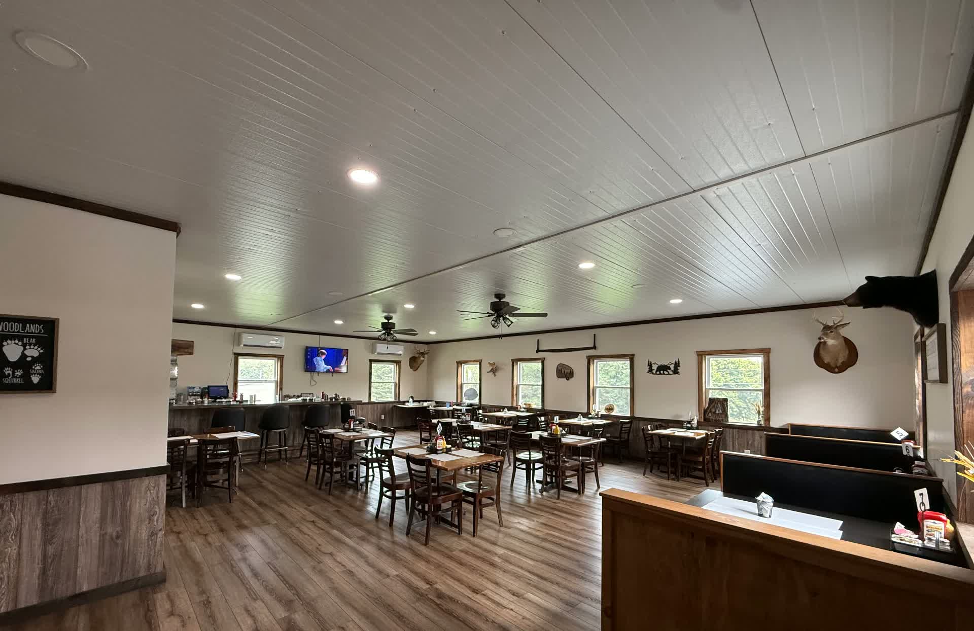 The Lost Acres Eatery dining room with wooden booths and tables