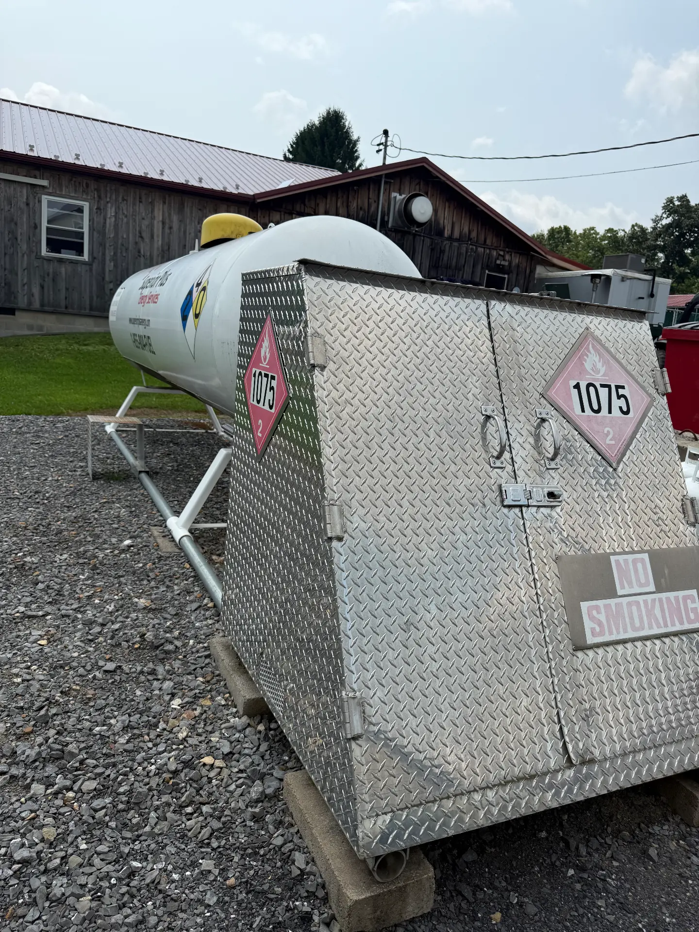 On-site propane tank and filling station beside the camp store building